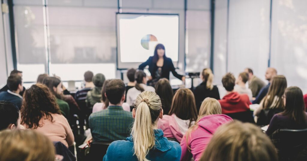 Woman presenting to group at 3D Animator Academy.