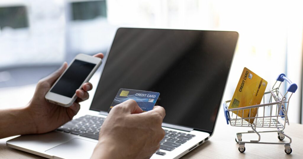 Image of online shopping concept with credit card, mobile phone, and laptop. Online bank transfer.