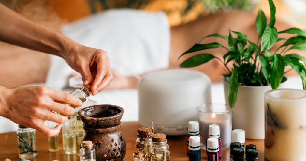 A woman massages her hands with essential oils, providing relaxation and nourishment.