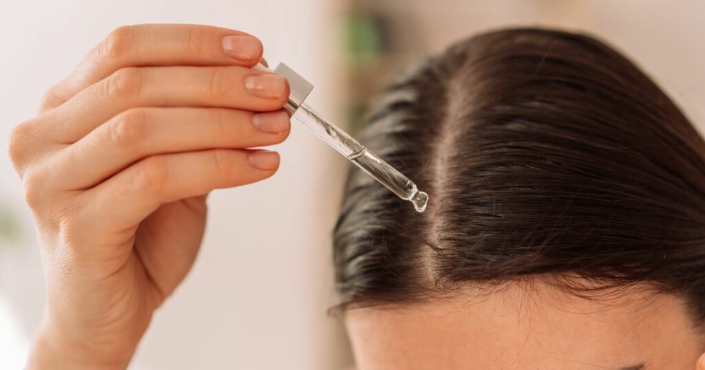 A woman practicing natural hair care.