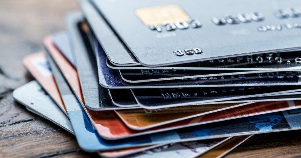 A stack of credit cards placed on top of each other.