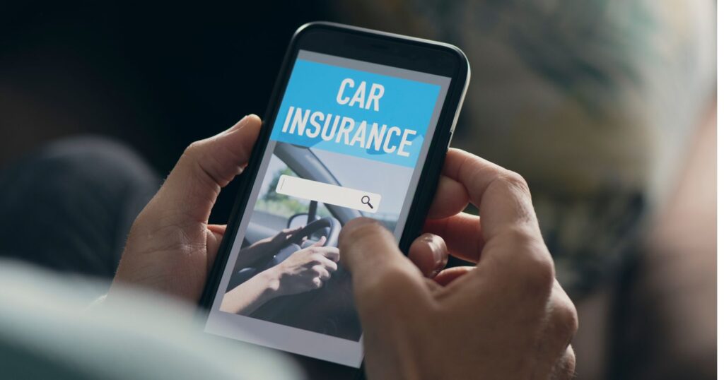 Mobile phone displaying car insurance comparison tool for quotes.