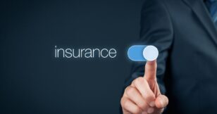 "Businessman touching 'insurance' word on a stock photo, representing the concept of insurance in the digital landscape.
